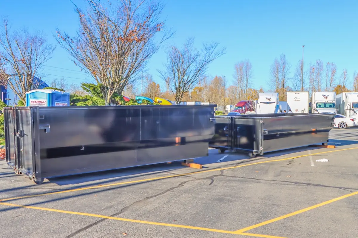 Professional dumpster rental service with roll-off container on residential driveway in Croton-on-Hudson